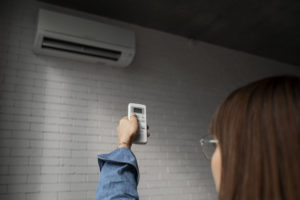 young woman using home technology
